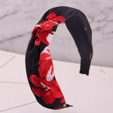 Diadema negra flores rojas