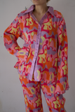 Conjunto de pantalón print naranja morado y rosa